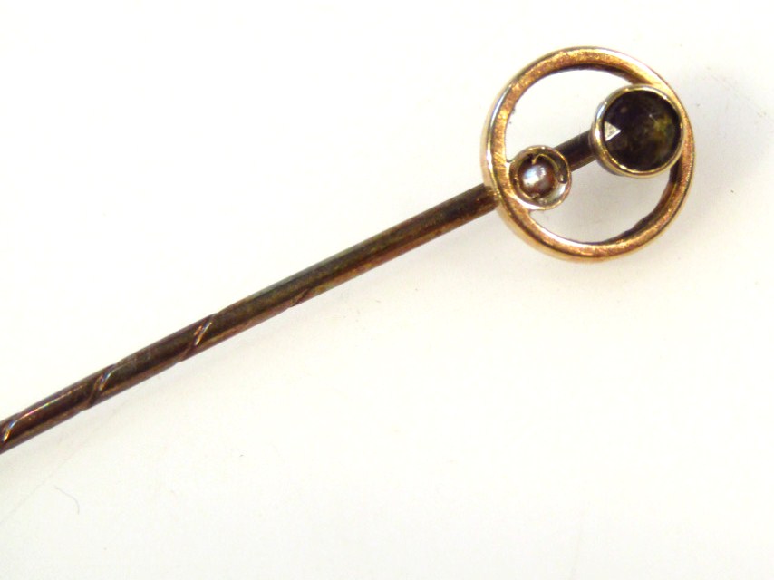 Appraisal: An early thC stickpin the circular top set with two