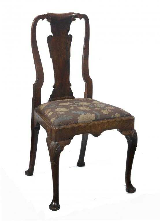 Appraisal: A GEORGE II WALNUT CHAIR the back with volutes and