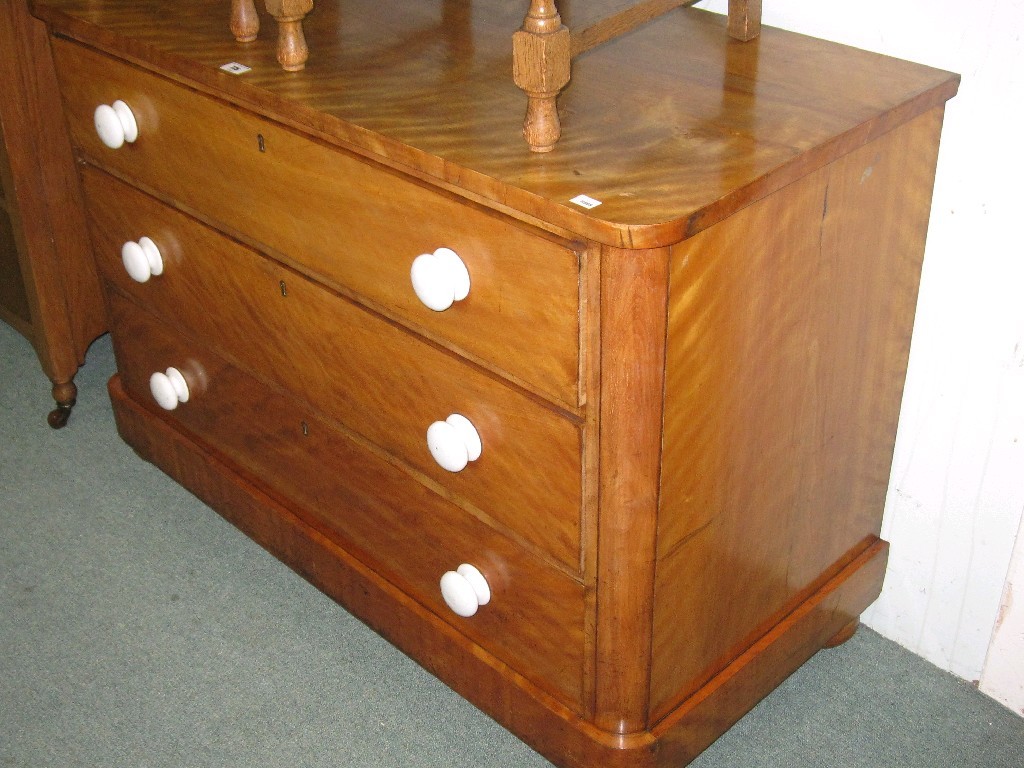 Appraisal: Victorian satin birch three drawer chest with porcelain handles