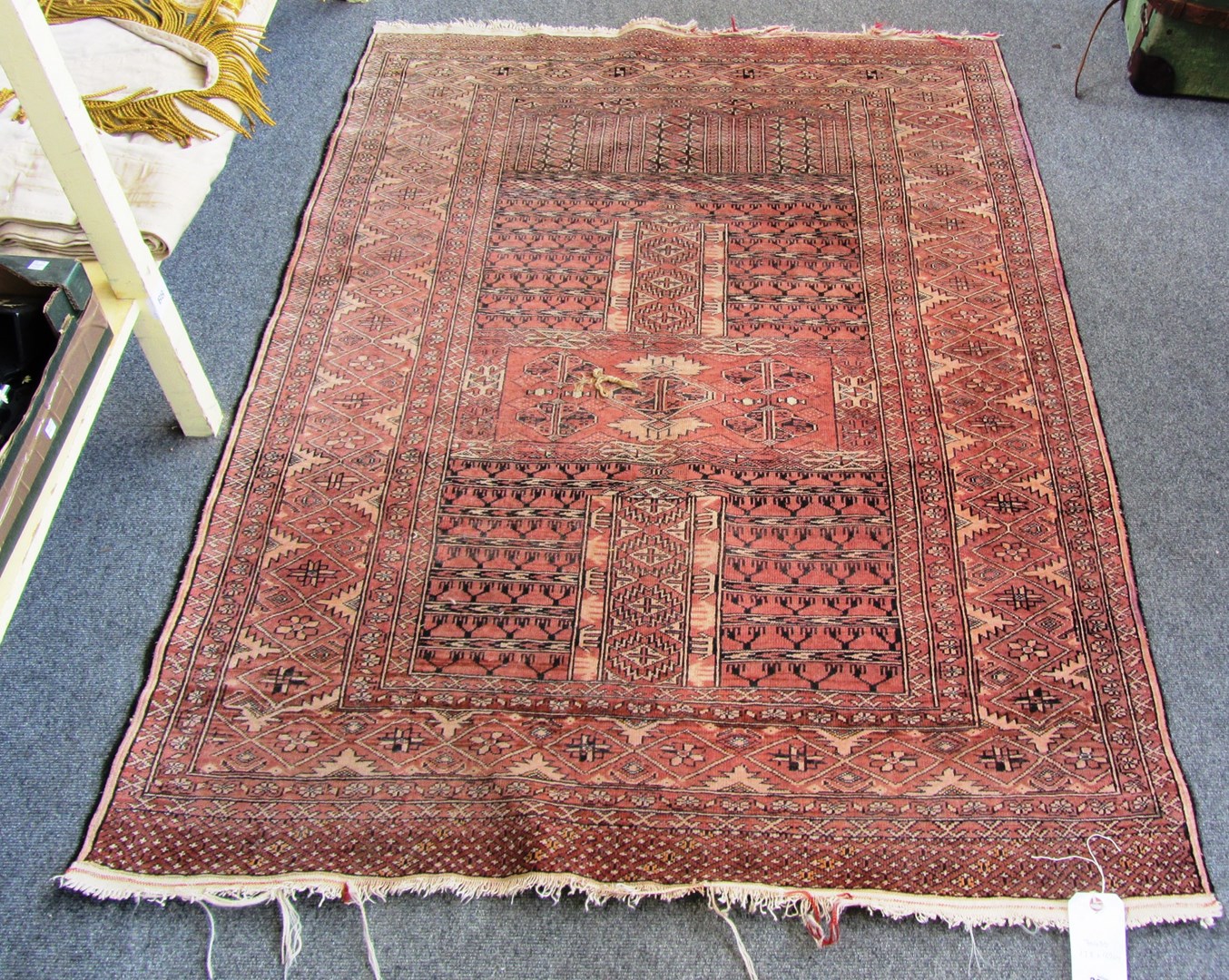 Appraisal: A Turkeman Engsi rug the madder field with candelabra quarters