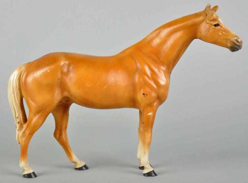 Appraisal: Cast Iron Hubley Thoroughbred Horse Doorstop Description Full figure Palomino