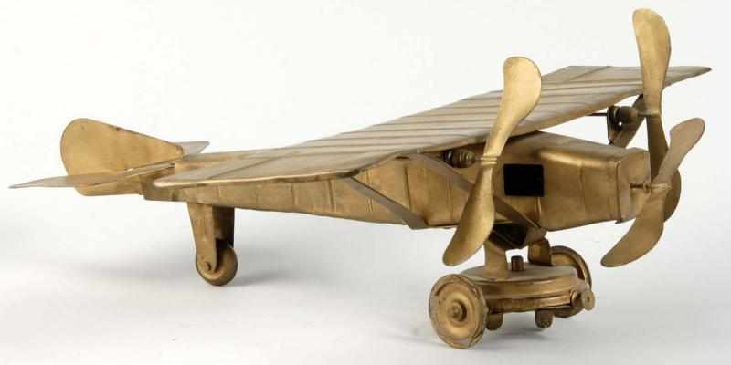 Appraisal: Pressed Steel Kingsbury Tri-Motor Airplane Toy Description American Wind-up mechanism