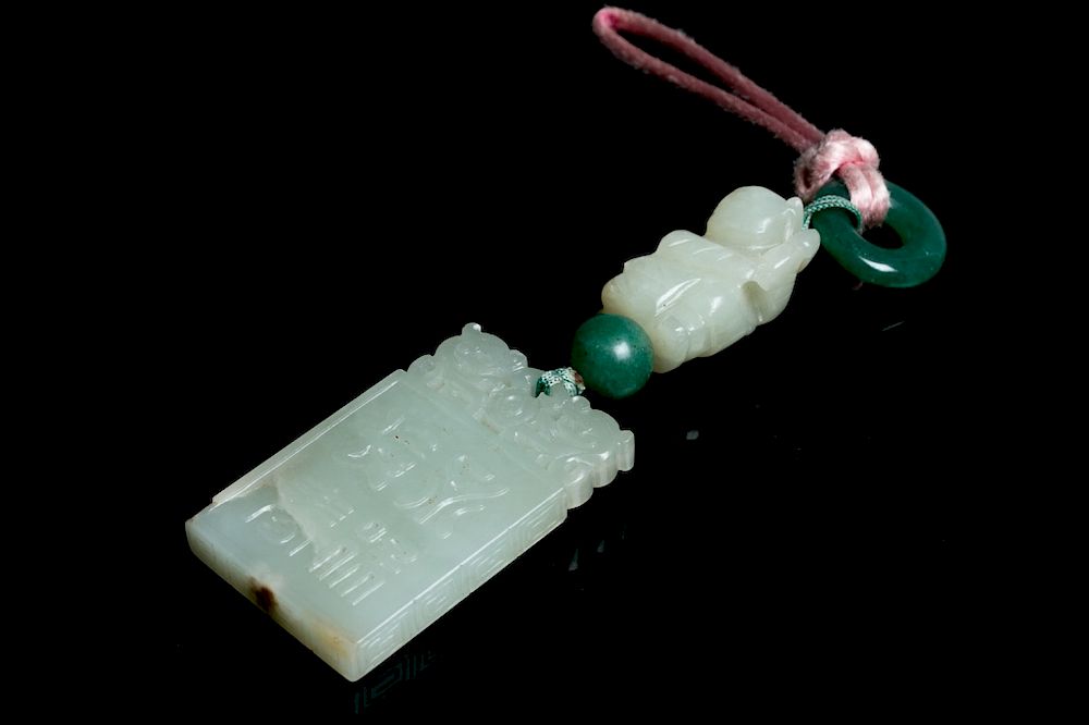 Appraisal: A JADE PENDANT The pendant comprising of a square form