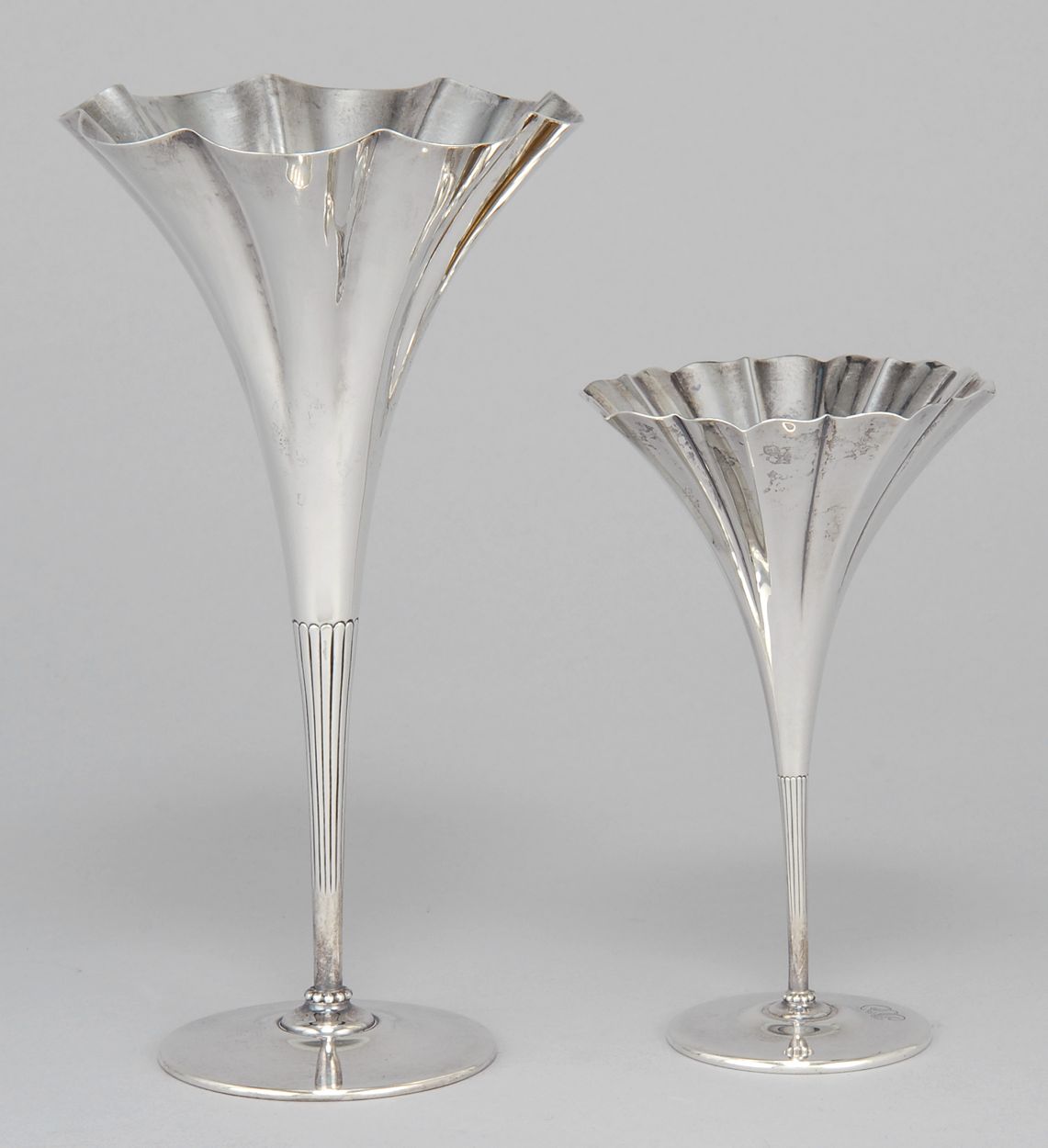 Appraisal: TWO TIFFANY STERLING SILVER TRUMPET VASES In floriform One with