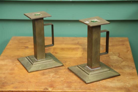 Appraisal: A PAIR OF BRASS ARTS AND CRAFTS CANDLESTICKS BY BRADLEY