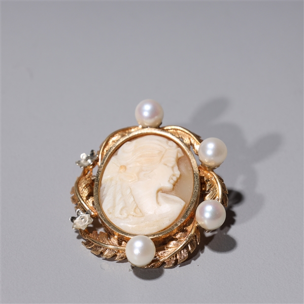 Appraisal: k gold pendant broach with pearls and carved cameo agate