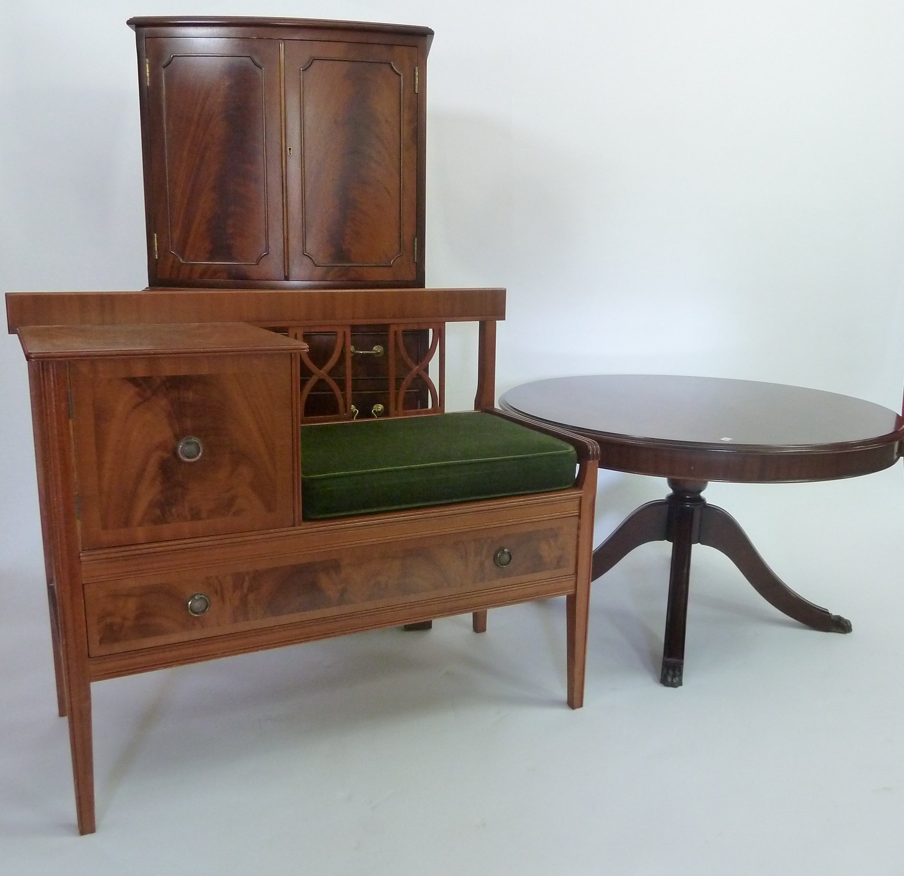 Appraisal: A George III style cabinet on chest a circular coffee