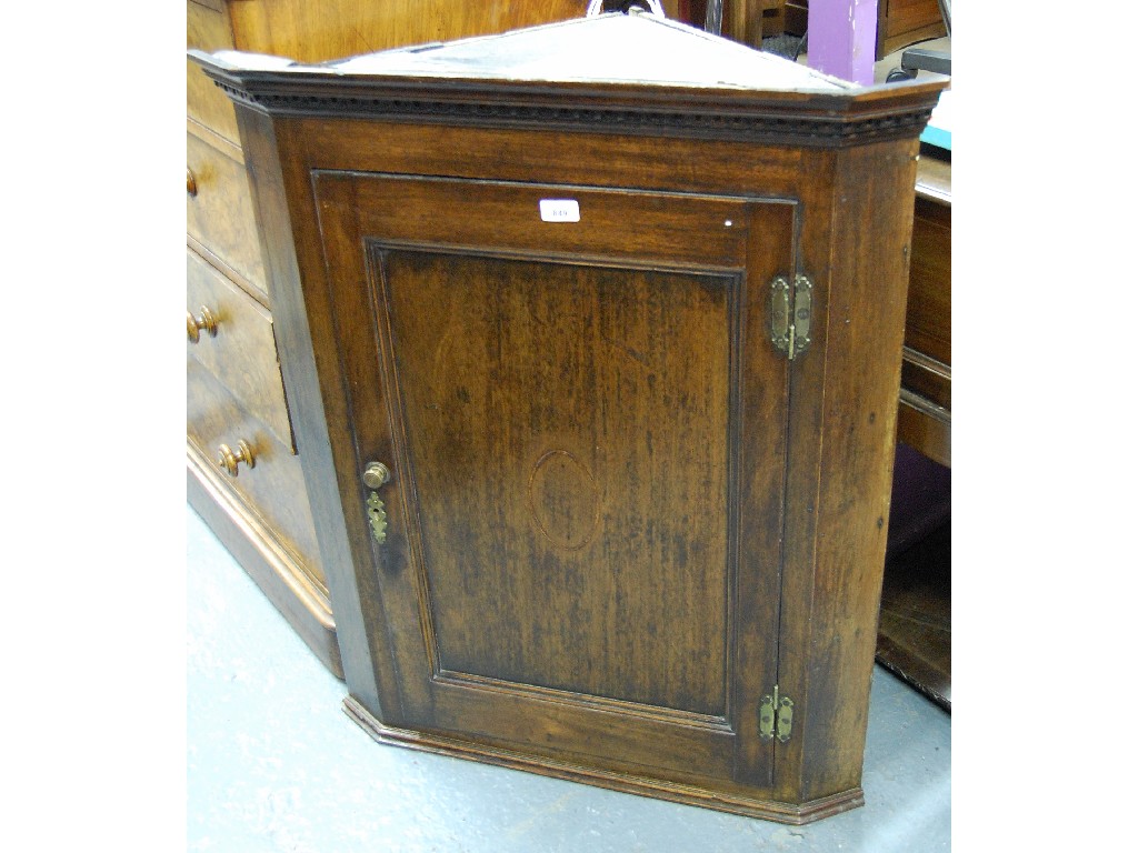 Appraisal: Georgian mahogany hanging corner cabinet with moulded key cornice above