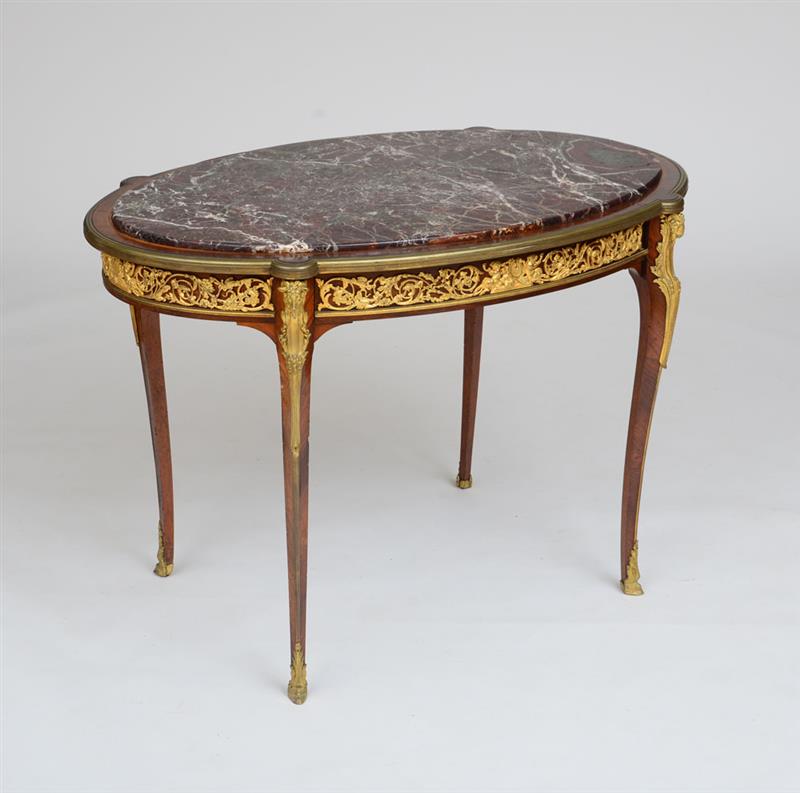 Appraisal: LOUIS XV XVI STYLE ORMOLU-MOUNTED KNIGWOOD CENTER TABLE Fitted with