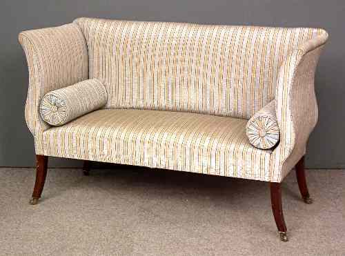 Appraisal: A mahogany Regency style sofa on sabre legs upholstered in