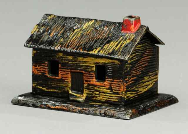 Appraisal: LOG CABIN MATCH HOLDER Kyser Rex scarce cast iron example