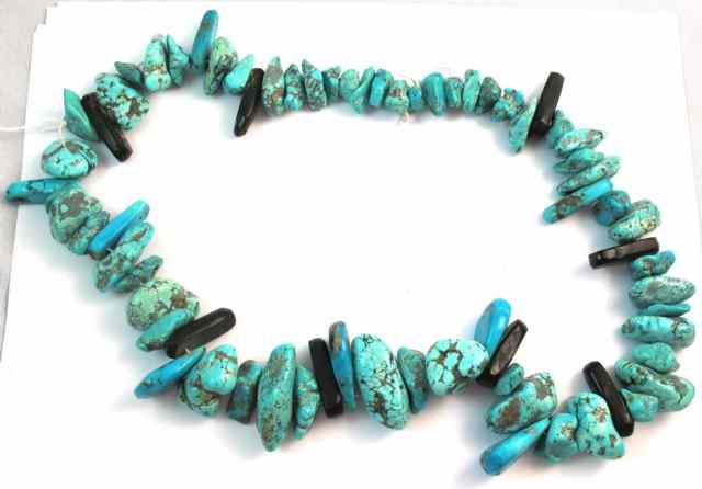 Appraisal: TURQUOISE NECKLACE consisting of approximately natural turquoise stones of greenish-blue