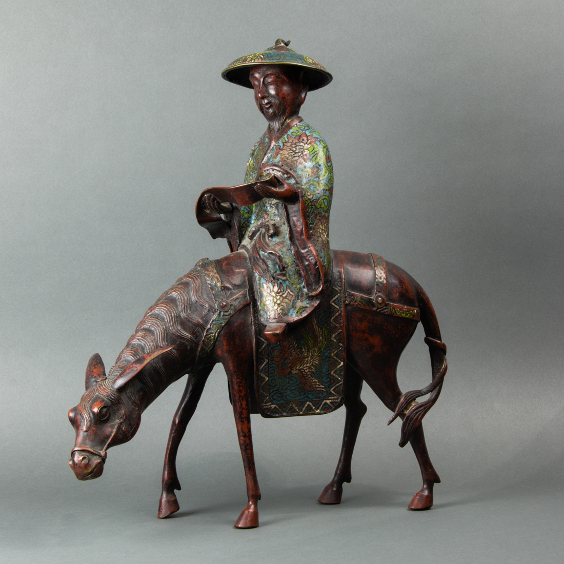 Appraisal: CHINESE BRONZE CHAMPLEVE FIGURE ON MULE Chinese bronze champleve figure