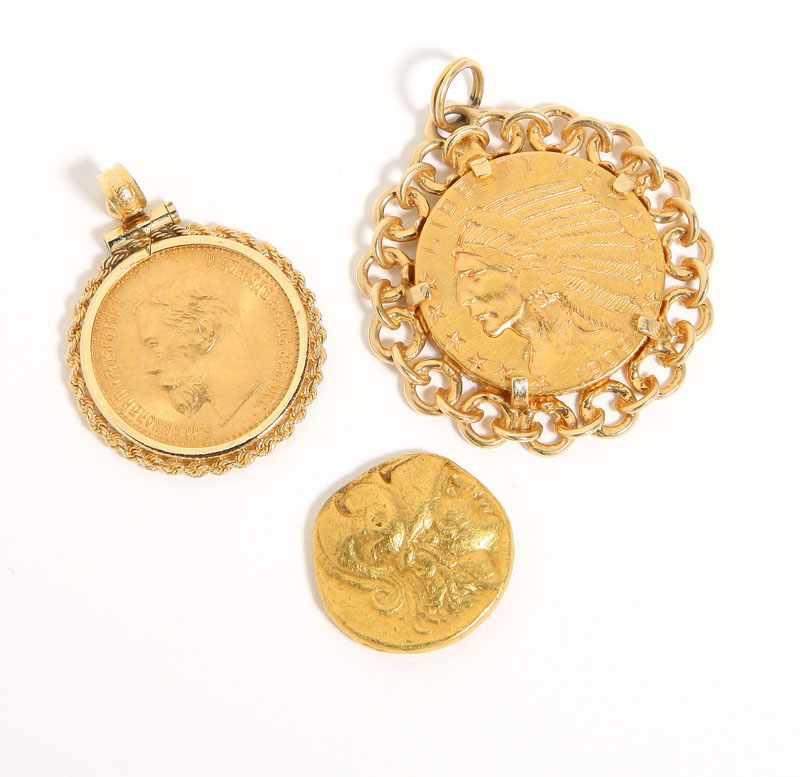 Appraisal: Two set in gold bezel pendants comprising a US Indian