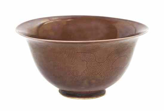 Appraisal: A Chinese Porcelain Footed Bowl having monochrome aubergine glaze with