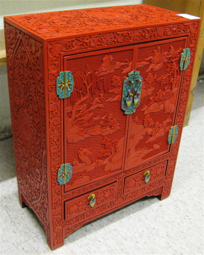 Appraisal: CHINESE CLOISONNE AND RED CINNABAR TABLE-TOP CABINET The diminutive cabinet