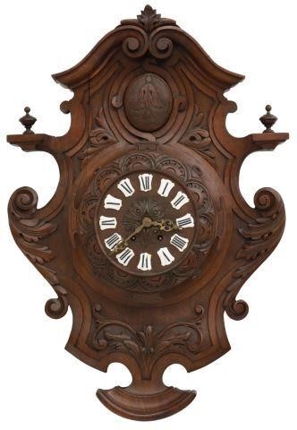 Appraisal: French wall-mounted clock th c carved walnut case centering a