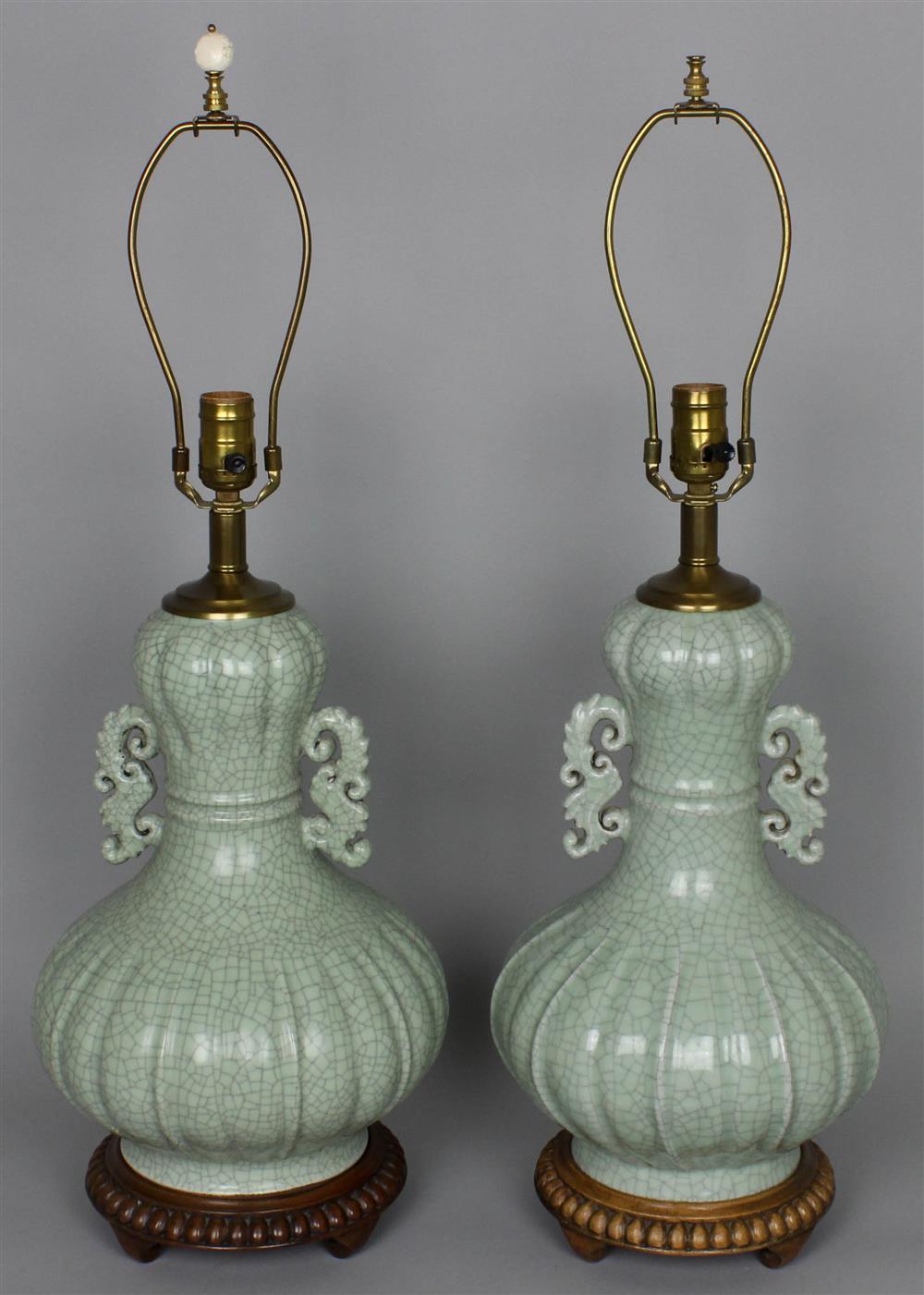 Appraisal: PAIR OF CHINESE ARCHAISTIC CRACKLE-GLAZED CELADON VASES NOW MOUNTED AS