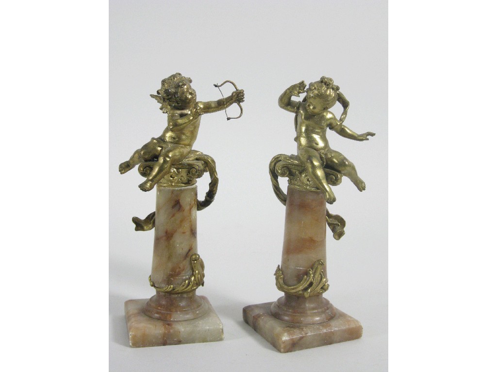 Appraisal: Pair of French gilt-metal Cupids one with bowl on alabaster