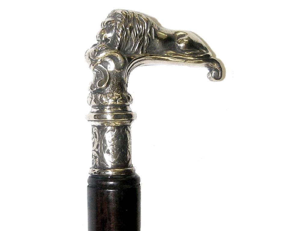 Appraisal: Ebonised hardwood walking stick the cast silver plated handle modelled