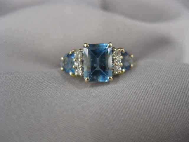 Appraisal: Blue Topaz Diamond Ring emerald cut gem with a trio