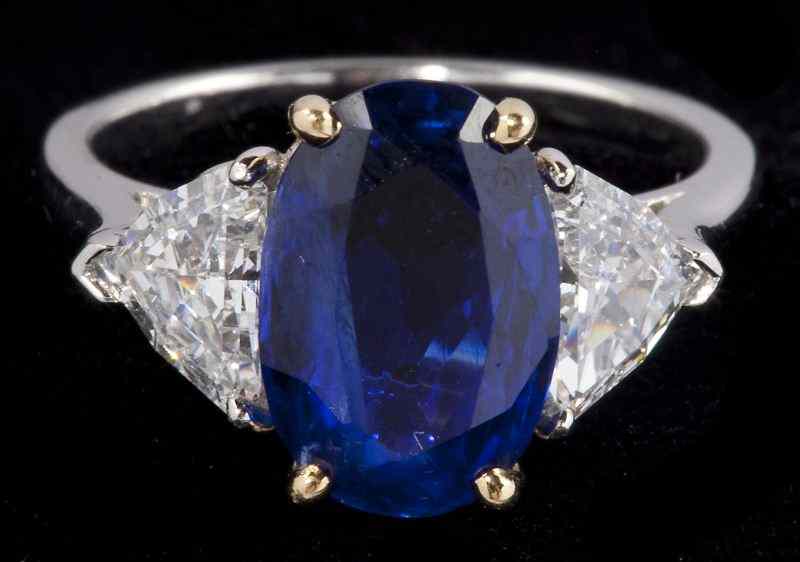 Appraisal: Platinum Sapphire and Diamond Ringcentering on one oval cut sapphire