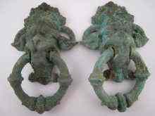 Appraisal: A pair of bronze lion mask and ring handles possibly