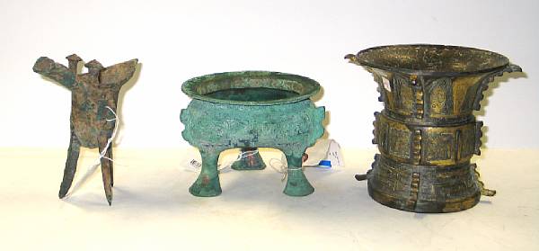 Appraisal: Three bronze vessels Including a gilt bronze zun with raised