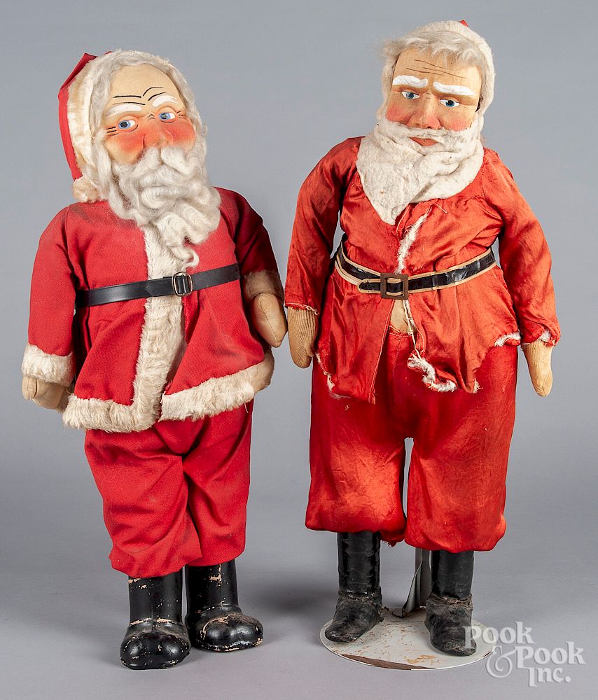 Appraisal: Two painted fabric Santa Claus figures Two painted fabric Santa