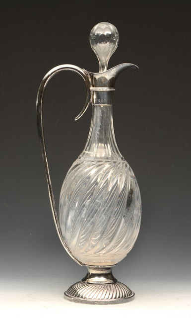 Appraisal: A GLASS CLARET DECANTER of bulbous form with applied silver