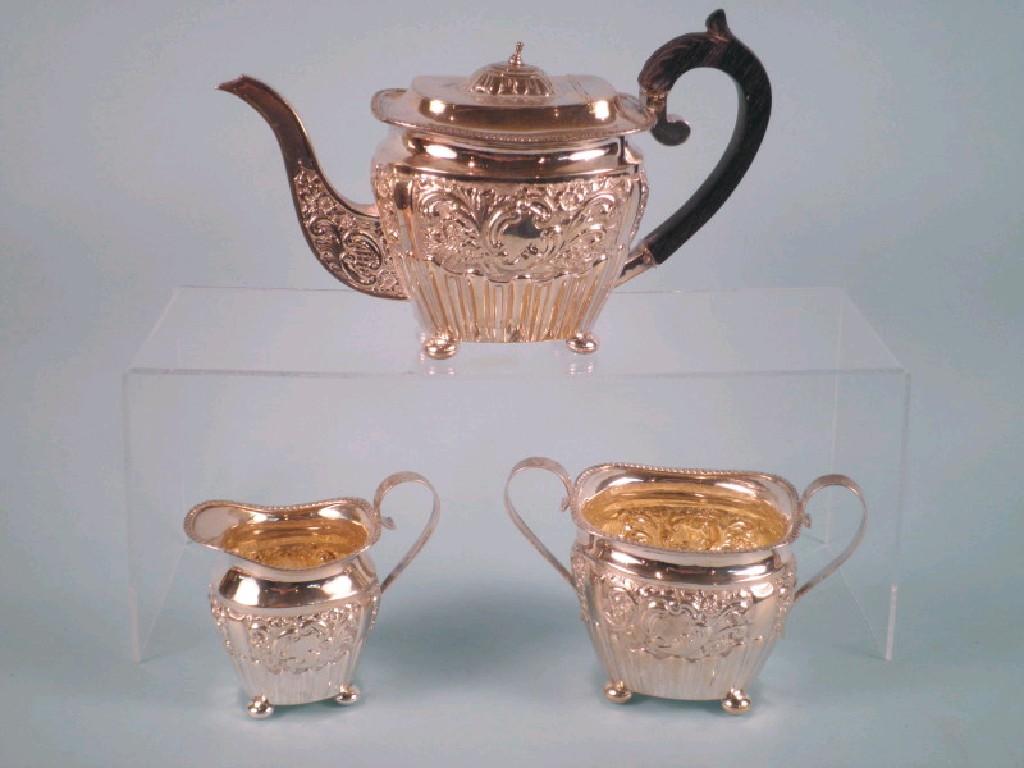 Appraisal: A silver three piece tea service part fluted and embossed