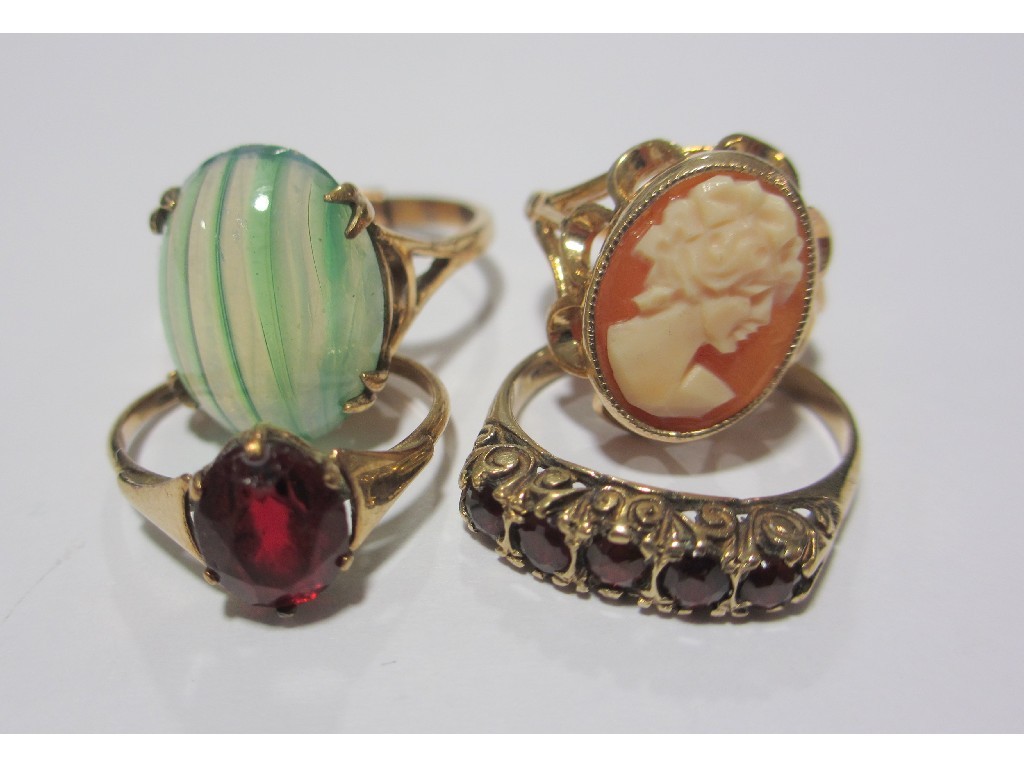 Appraisal: Four ct gold rings to include agate single stone garnet