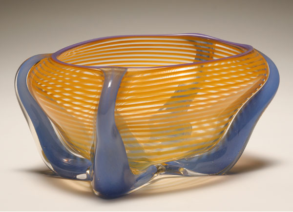 Appraisal: Studio glass bowl with yellow striping on four blue glass