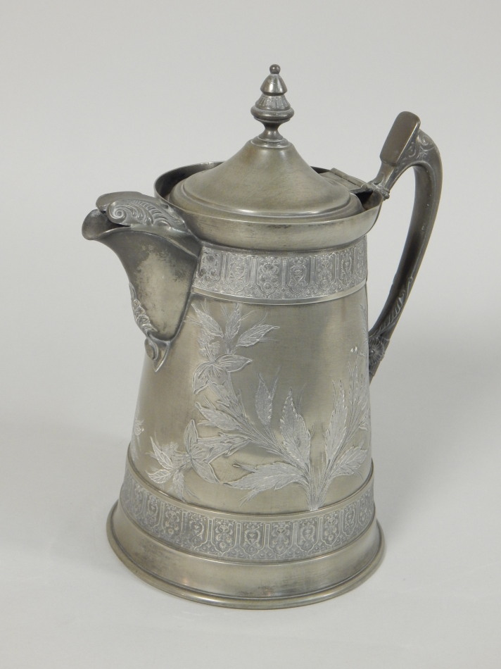 Appraisal: A Victorian Britannia metal large jug decorated with flowers etc