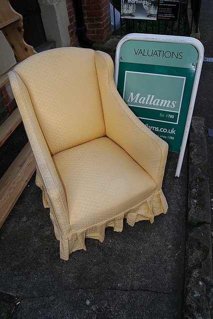 Appraisal: AN EDWARDIAN MAHOGANY FRAMED SMALL ARMCHAIR with yellow patterned upholstery