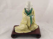 Appraisal: A ceramic model of a seated Buddhist monk ht cm