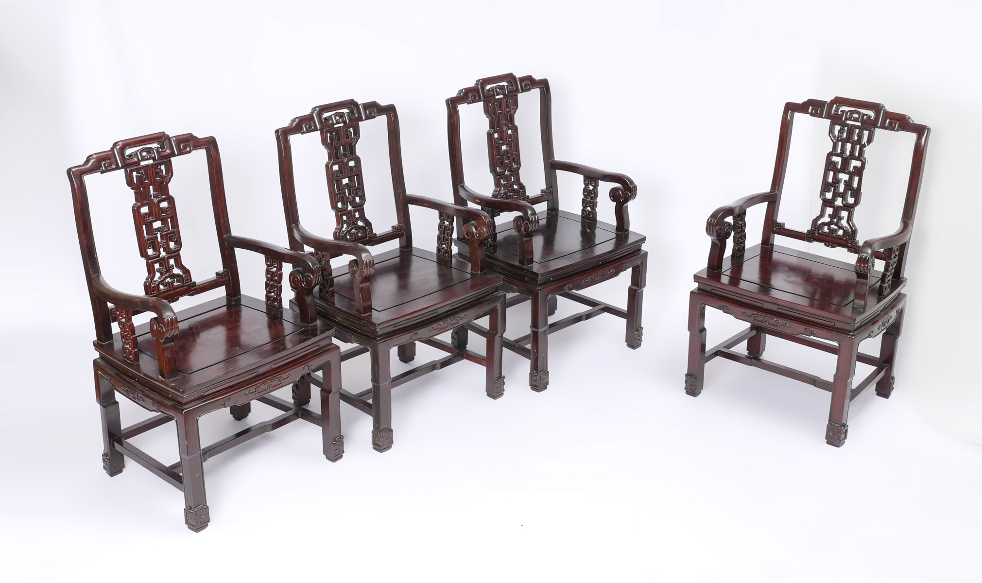 Appraisal: CARVED CHINESE ARMCHAIRS carved Chinese armchairs having a pierced splat