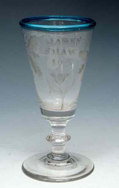 Appraisal: A SHORT ALE GLASS with turquoise rim on blade knop