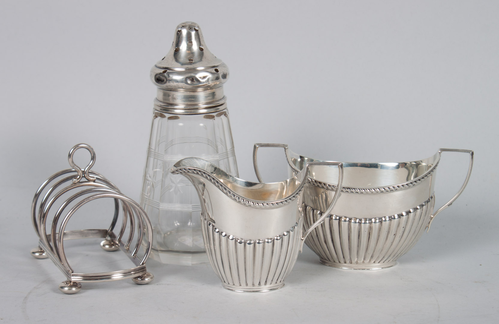 Appraisal: Four English silver table articles including open sugar bowl cream