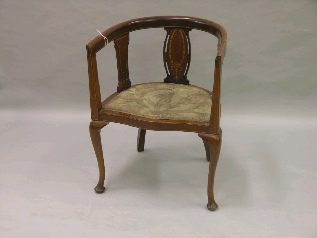 Appraisal: An Edwardian inlaid mahogany tub armchair with upholstered seat on