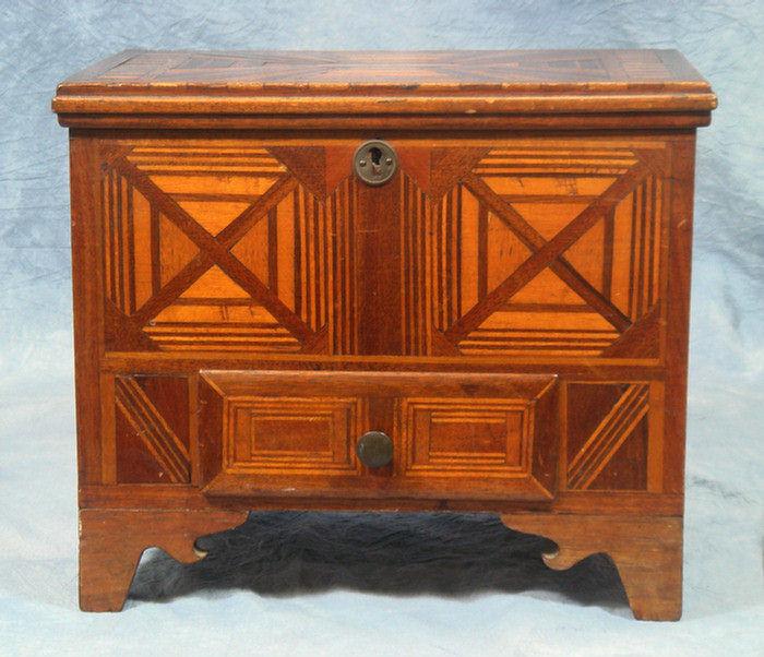 Appraisal: Inlaid tramp art miniature lift lid chest with drawer geometric