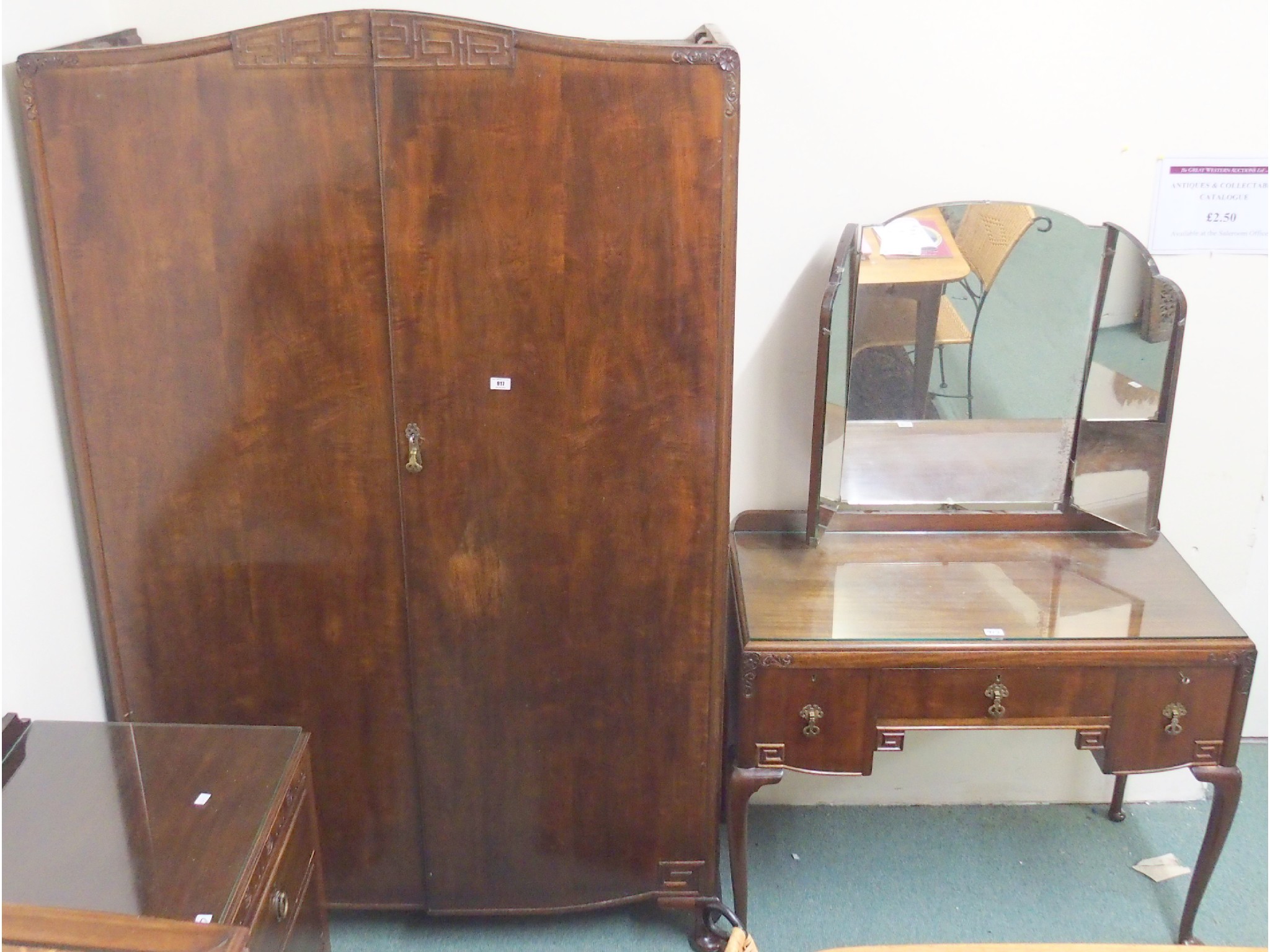 Appraisal: A mahogany bedroom suite comprising wardrobe dressing table and a