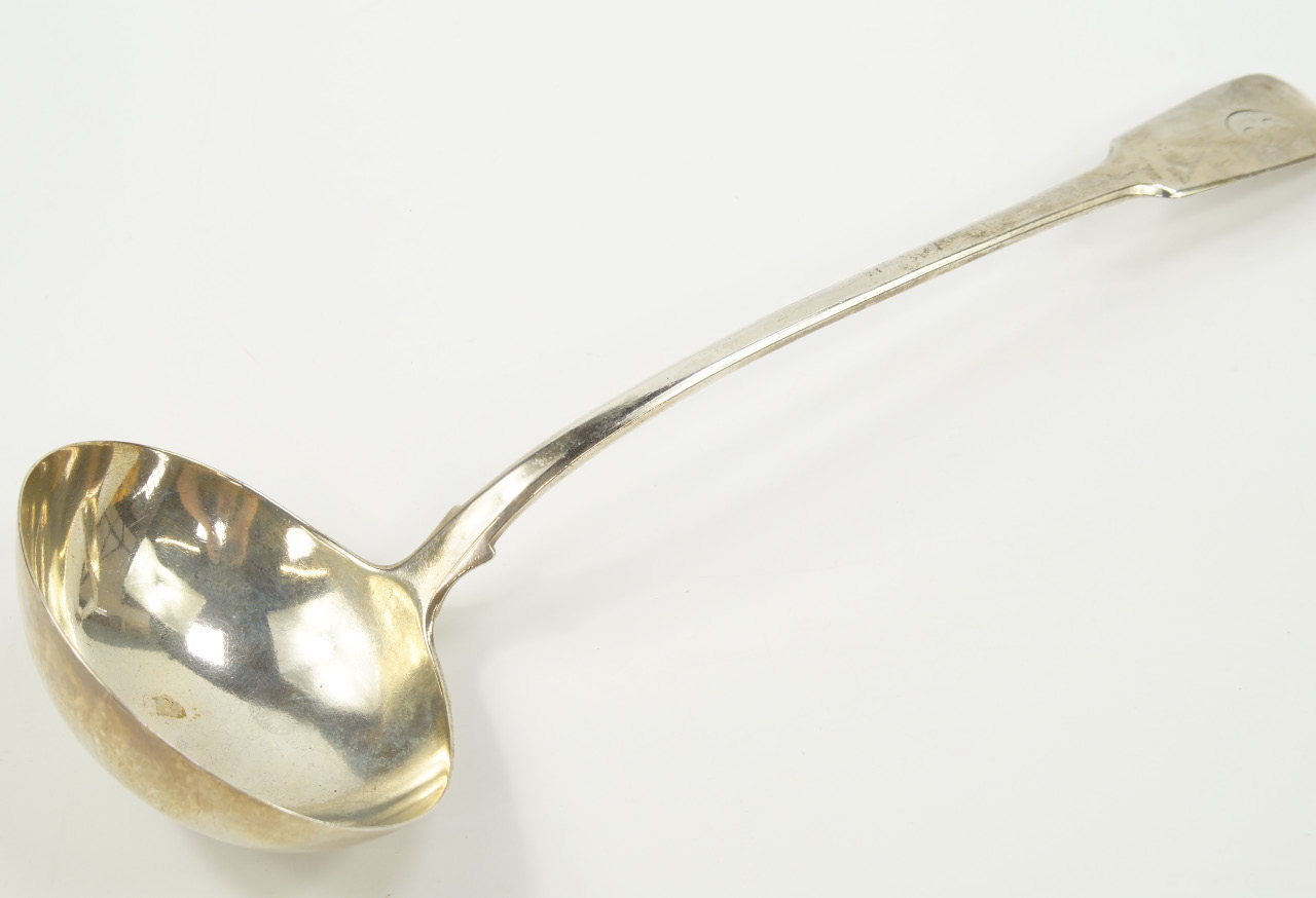 Appraisal: A George III silver soup ladle initial engraved William Eley