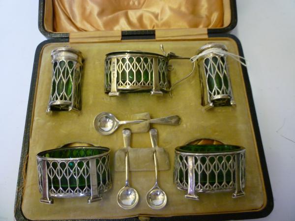 Appraisal: AN ARTS AND CRAFTS STYLE FIVE PIECE CRUET maker Levi