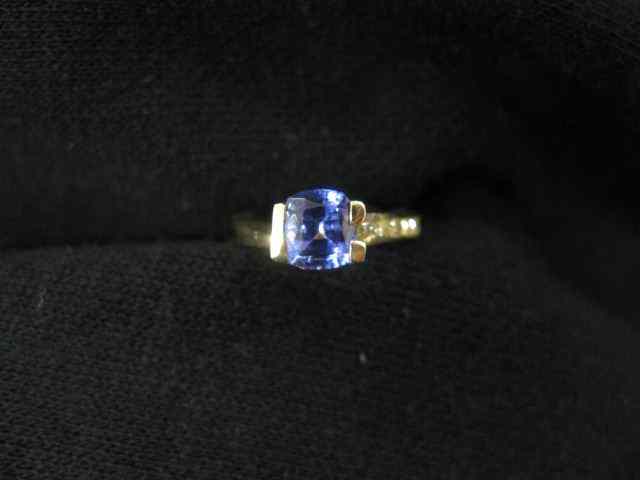 Appraisal: Tanzanite Diamond Ring carat cushion cut gem weighing carat diamonds