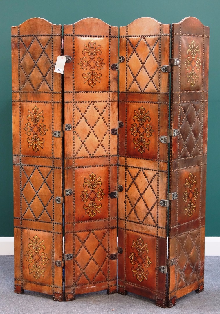 Appraisal: A studded painted leather arch top four fold draught screen