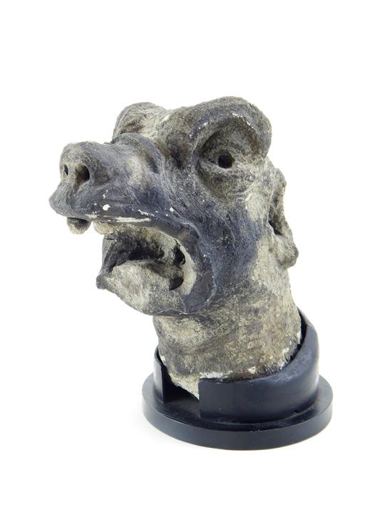 Appraisal: Early architectural carved stone element depicting a gargoyle head with