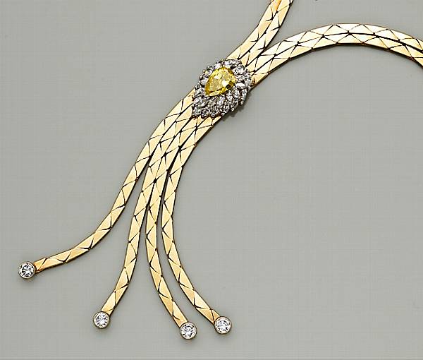 Appraisal: A treated yellow diamond diamond and fourteen karat gold necklace