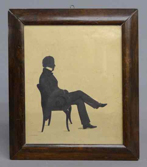 Appraisal: th c silhouette of a seated man in walnut frame