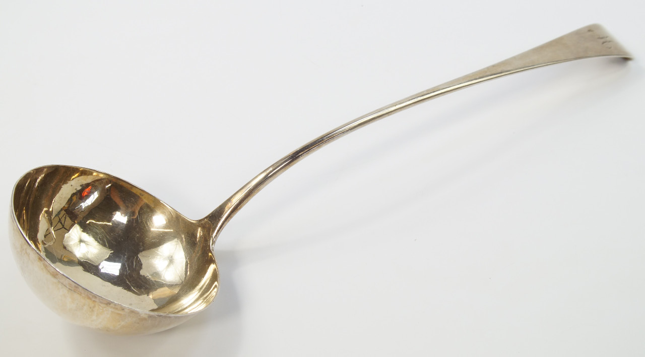 Appraisal: A George III silver soup ladle initial engraved Thomas William